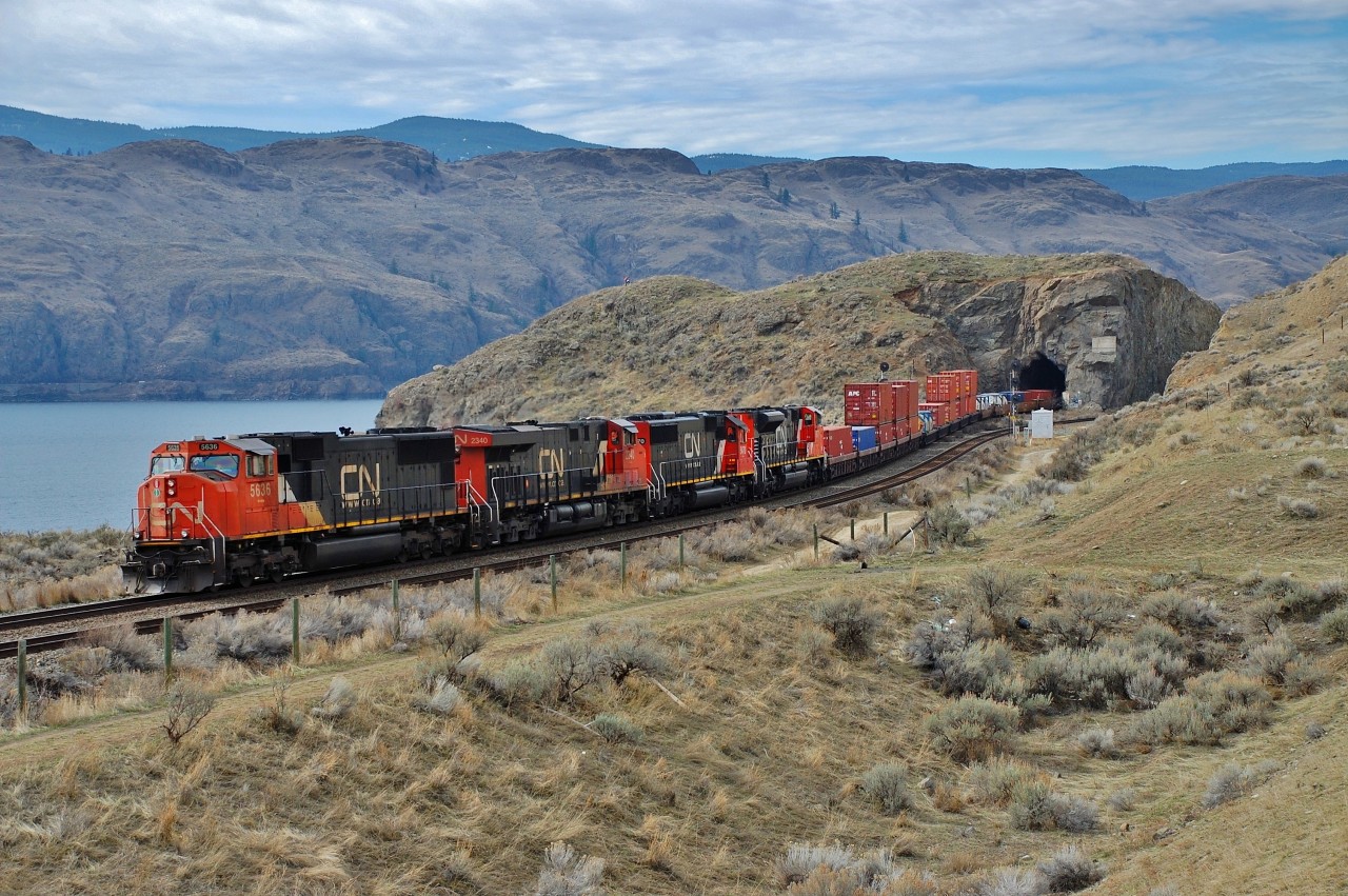 CN 5636 is leading this eastbound Intermodal out of the tunnel at Kissick and headed for Kamloops.