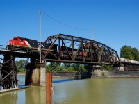 CN nos.2000&5662 are crossing the Fraser River on the Lulu Island bridge at the head of a westbound mixed freight.