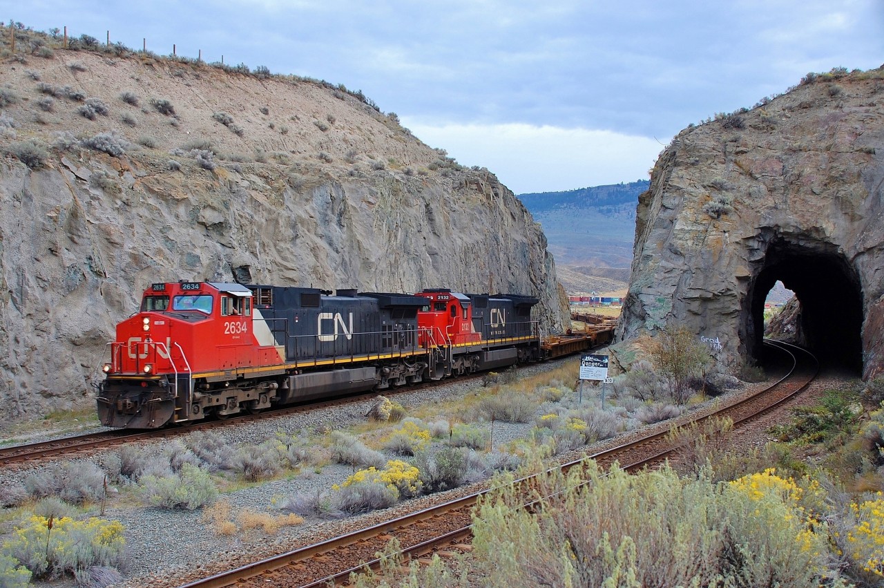 Cn nos.2634&2132 bring a westbound mixed freight through the cutting at Kissick and greet the photographer with a friendly serenade on the horn.