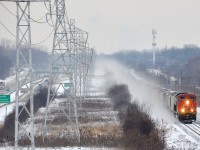 An extremely late CN 310 is through Beaconsfield with CN 8846 at the head end and CN 3025 mid-train as it parallels autoroute 20 on a frigid afternoon.