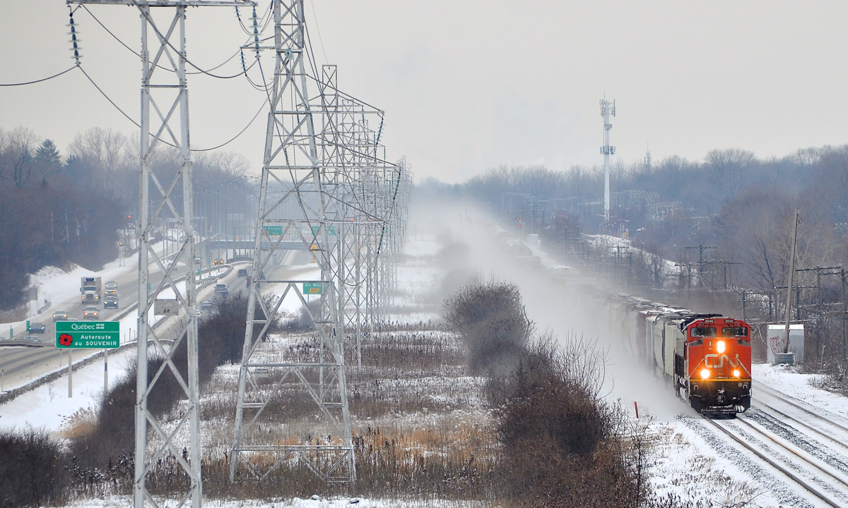 An extremely late CN 310 is through Beaconsfield with CN 8846 at the head end and CN 3025 mid-train as it parallels autoroute 20 on a frigid afternoon.