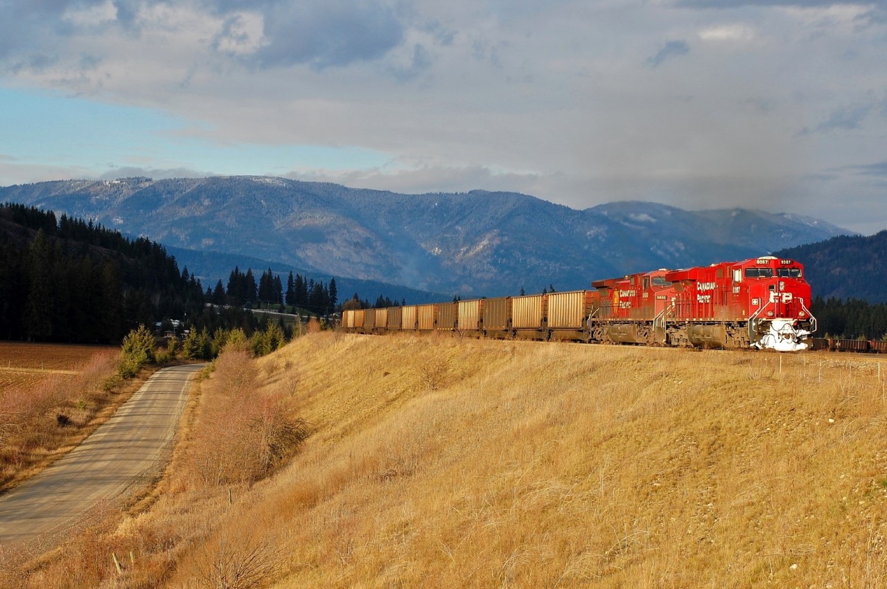 The afternoon sun is highlighting this westbound coal train as it rounds the loop at Notch Hill, led by CP 9367.