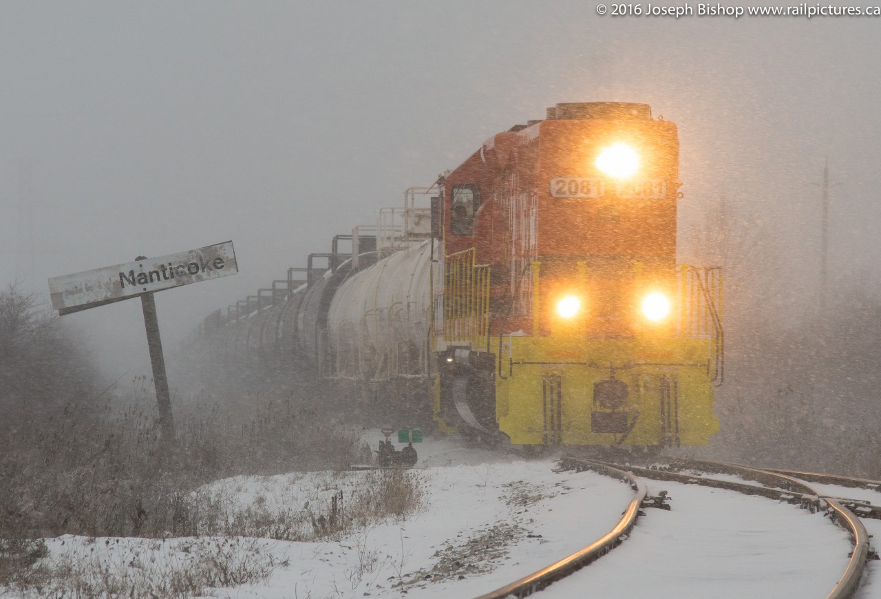 It was bitter, it was cold and it was snowy!  RLHH 2081 is seen lifting a cut of cars dropped off at the Nanticoke sign by RLHH 595 a little earlier.  2081 is working hard to get the train moving and would shortly be applying their horn for the crossing activating its unique alternating ditch lights.  Snow streamers this afternoon made visibility near to none for parts of Southern Ontario...Nanticoke not being the exception.