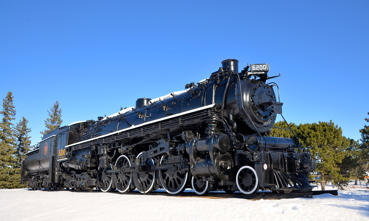 CN 6200 is a 4-8-4 Northern which is preserved on the grounds in front of the Canada Science and Technology Museum. It is in the middle of being refurbished, with it having received a new coat of paint, numberboards and new lettering. Work remains to be done, but it is already looking a lot better than it used to. It is seen here on a cold but crystal clear Christmas day.