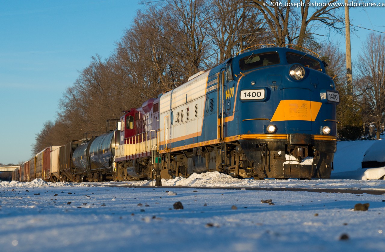 OSRX 1400 and OSRX 1620 have just coupled on to the cars that CP T69 left for them earlier in the afternoon at Woodstock as the last light of the day sets on the scene.