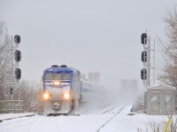AMT 1327 leads AMT 90 (the mid-day departure from Candiac) onto the island of Montreal on a very snowy day as it approaches Lasalle Station.