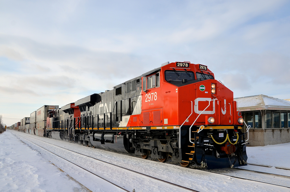 CN X106 has brand new CN 2978 leading (with CN 2929 trailing) as it heads east through Dorval with containers for Montreal. CN 2978 is an ES44AC and not GE's newest North American freight model (the ET44AC). I believe this is because it is a Tier 3 credit unit (allowed due to GE applying emission credits that had already been banked towards them).