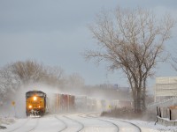 CSXT 5292 leads CN 327 as it negotiates the s-curve just east of the Dorval Station on CN's Montreal sub on a frigid afternoon. 