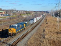 <b>New and old.</b> Nearly brand new ET44AH CSXT 3429 is leading 35-year old SD40-2 CSXT 8153 on CN 327 which is westbound on CN's Kingston Sub on a sunny day (finally, after a week of rain and clouds).