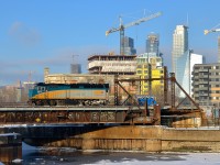 For reasons unknown, VIA 6414 is running light power past Wellington Tower after leaving Montreal's Central Station. It is crossing the Lachine Canal the day after Montreal got a decent amount of snow.
