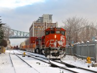 CN 149 is slowly pumping air on a cold morning before leaving Port of Montreal trackage and heading west on the CN Wharf Spur.