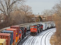 <b>A busy morning.</b> It's a busy morning on CN's Montreal Sub, with three freight trains passing simultaneously. From left to right is CN B730 approaching Turcot West eastbound to change crews, CN 149 westbound with CN 8844 & CN 2224 and CN 324 eastbound with CN 5640, NS 9764 & CN 9411.