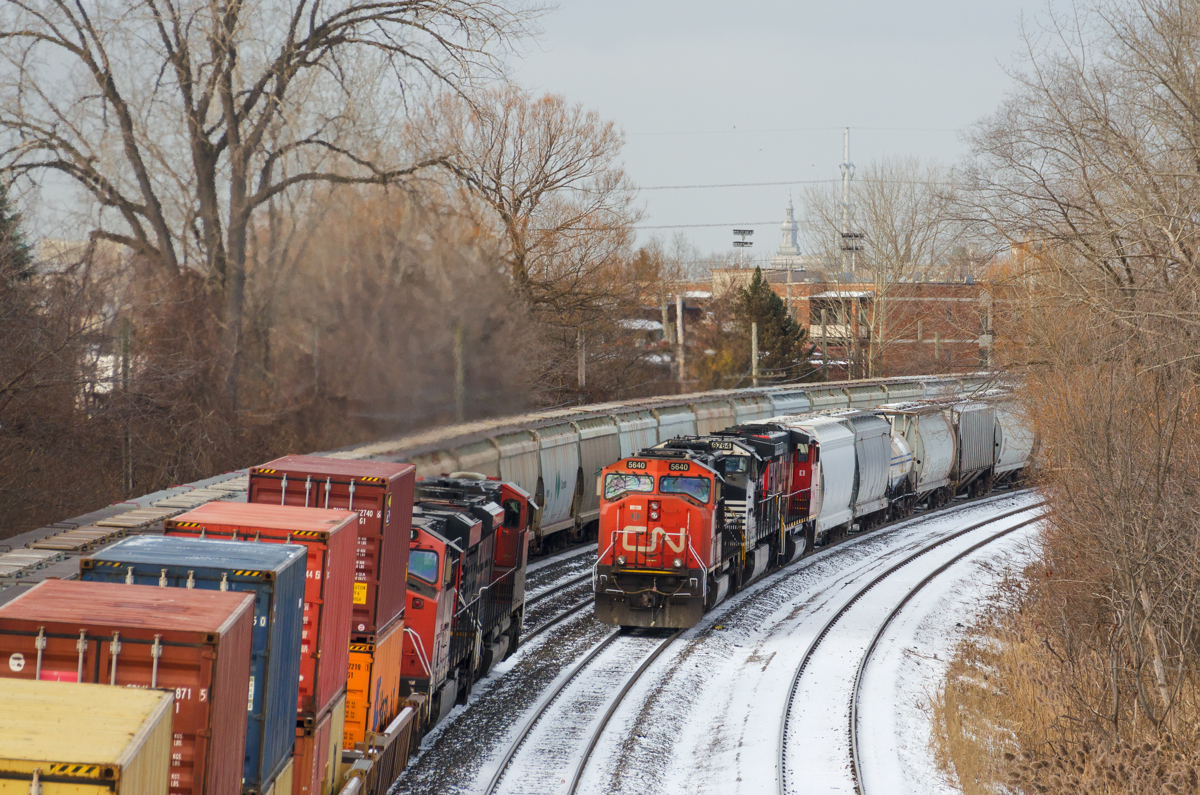 A busy morning. It's a busy morning on CN's Montreal Sub, with three freight trains passing simultaneously. From left to right is CN B730 approaching Turcot West eastbound to change crews, CN 149 westbound with CN 8844 & CN 2224 and CN 324 eastbound with CN 5640, NS 9764 & CN 9411.