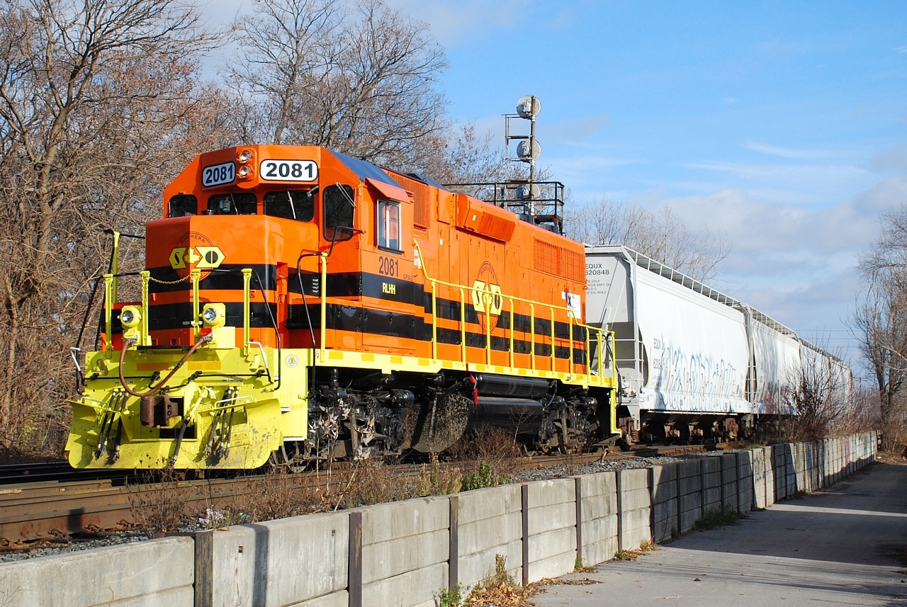 For a shot I had not intended to take, it came out pretty good.  I managed to cross paths with this train three times in my travels for work today, this being the third.  While driving on Grey Street I happened to see a bright orange thing out of the corner of my eye.  I had figured RLHH 496 was long gone, but I managed to get to the end of George Street and jump out for a quick shot as 496 backed in to the CN yard with RLHH 2081, four hoppers from Ingenia and NECR 3840 shoving.