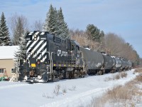 Southbound from its home base in St-Felix-de-Valois, Chemin de Fer de Lanaudière #3000 heads for Joliette and the Quebec Gatineau interchange with six empty propane cars.  The RS-18 is the former SFEX 3000 demonstrator from Eastern Railway Services.  