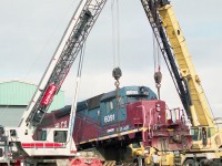 Wheel changeout taking place in Goderich yard in front of the enginehouse. The unit is one of I think 2 leased to the railroad at that time. Great runners, but not very photogenic.