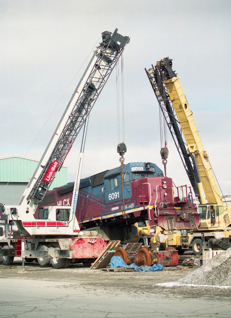 Wheel changeout taking place in Goderich yard in front of the enginehouse. The unit is one of I think 2 leased to the railroad at that time. Great runners, but not very photogenic.