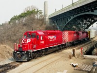 Back in 1995 when we were inundated SD40s and SD40-2s on the CP, I remember seeing this train coming and thought "meh!!"  But the leader had a fresh coat of paint!!  So at least that was worth grabbing a shot of. I was probably wandering around by the High Level bridge and spotted the train coming thru Bayview; as it used to run Toronto-Buffalo along the CN Oakville sub, crossing to CP at Hamilton Jct. Looking back, I am glad I scurried over the hillside for this shot. Never would I have imagined how grubby and pathetic looking the paint jobs on most of today's CP leaders would look. :o) Power is CP 5620, 5640 and 5602.