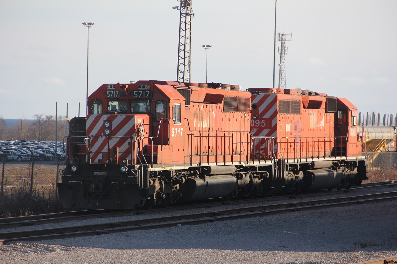 Possibly a fitting end being partly shadowed. CP 5717 and DM&E 6095 ( cp 5556 ) have just been spotted in the CN,s  north yard at Oshawa by CP 2319 and 2214. The 2 units will be forwarded by CN to Pickering and there final resting place. Of interest CP 5717 was the last candy stripped SD delivered to CP in 1975.  CP 5718 would be the first production line unit with 8 inch reflective stripping.  5556 was built in 1967.Just shy of 50 years.