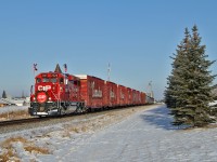 On a beautiful sunny but cold (-20) day CP's holiday train departs Innisfail having just completed it first stop and show of the day.