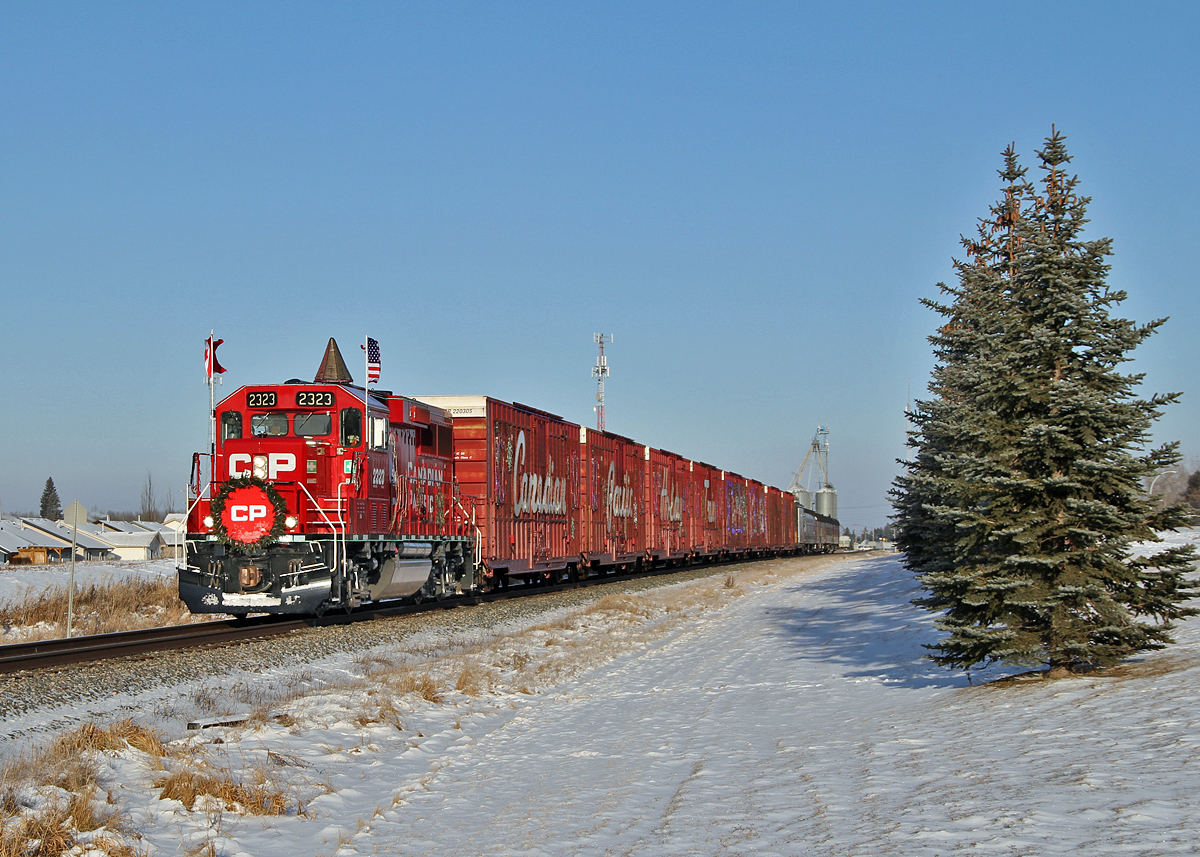 On a beautiful sunny but cold (-20) day CP's holiday train departs Innisfail having just completed it first stop and show of the day.