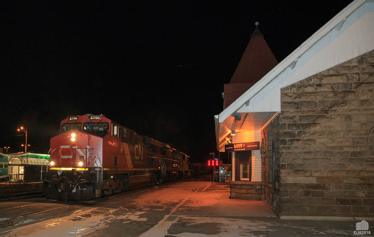 CN M383 through Georgetown on a cold frigid winter night with CN 2305, CN 2122, CN 5776 and CN 2258 mid train DPU.