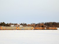 After finishing its work in Wolverton, CP 242 receives its OCS clearance from Wolverton to GUE. With 66 cars on the drawbar UP 5373 and UP 5547 motor right along east to Toronto.