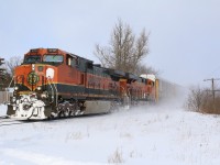 After a full day of chasing OSR's snow plow extra clearing a pair of former CPR lines, catching CN 393 with a pair of BNSF "toasters" was a nice finish to a very successful day. The two foreign units are seen kicking up fresh snow as they storm through the quiet village of Beachville. 