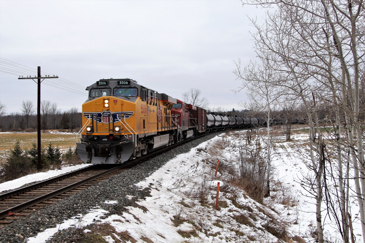 CP 647, with its UP 5506 and CP 8804 for power, roll around the bend on the approach to the Victoria Road crossing in Puslinch on their way to Orr's Lake.