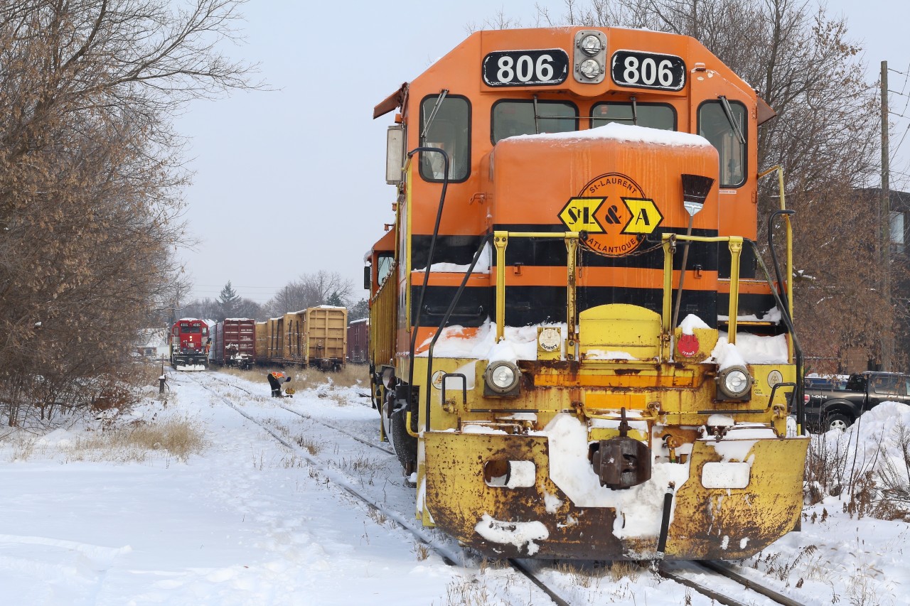 The power this week between trains 580 and 582 has been swapped as 580 stops to throw a switch in the small yard in Guelph. Train 582 waits in the distance for 580 to clear so it can head to the mainline to lift its cut of cars.