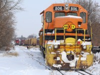 The power this week between trains 580 and 582 has been swapped as 580 stops to throw a switch in the small yard in Guelph. Train 582 waits in the distance for 580 to clear so it can head to the mainline to lift its cut of cars.