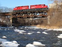 The sound of the constant flow of the Credit River is briefly drowned out by the sound of steel on steel as local T14 rattles across the old bridge over the river. Today there will be no stopping to work the large Ardent mill just west of the bridge, instead it's a strait run into Streetsville yard, with work on the branch as well.
