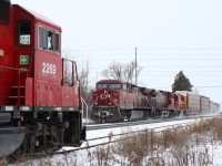 The last T14 of the year to Streetsville has finished its work in town and is ready to head light back to Toronto. The crew has stepped down briefly from the cab to inspect the passage of train 240 before heading back to the warmth of the cab to wait for a MofW crew to clean their switch leading to the mainline. The train will then head for home ending another year of serving "the village in the city".