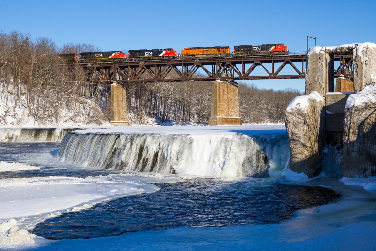 Nearing the completion of its Chicago to Toronto run, CN train no. M394 soars above the (partially) frozen waters of the Grand River at Paris, Ontario.

..and no Mr. Smith, neither Joseph or I decided to go swimming today ;)