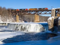 Nearing the completion of its Chicago to Toronto run, CN train no. M394 soars above the (partially) frozen waters of the Grand River at Paris, Ontario.

..and no Mr. Smith, neither Joseph or I decided to go swimming today ;)