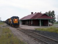 ONR 1805, 1735 eastward past the Iroquois Falls station with a long set of cars. What appears to be a mainline is actually a dead end not too far behind me. At least that is what the timetables show. The track appears to be well used, and I am wondering if it is for pulling ahead, then backing into the yard.  Anyone familiar with the operations around town before the mill closed down at the end of 2014? I am curious as to whether this Sub is used at all any more.