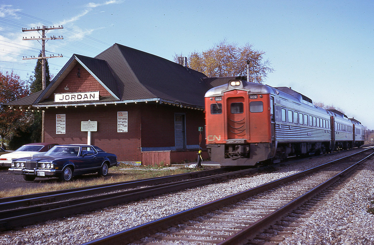 I remember this scene well as I was just breaking in that new blue 1976 Mercury Cougar (I think it was RP'r "snakes" favourite car :o)back then) and it had only about 1000 miles on it. The Jordan station, seldom photographed except for when Steam special 6060 rolled by, was on its last days already. It was up on wheels and moving to its new home a few hundred feet south by May of 1976. It still serves to this day as a beautiful residence, complete with name sign. Most photographers in the area preferred to shoot trains going over the Jordan harbour bridge, about 1/2 mile to the west. Anyway, I drove in hoping to get those Budds en-route to Niagara perhaps stopping at the station, but it was no go. They literally flew by, and you can see I did not have the camera set high enough to freeze the motion.