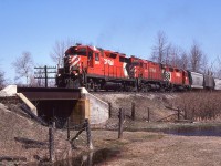 It is a beautiful spring day. The ground is still wet though. Extra westbound CP 5015, 4245 and 5024 made the day even nicer. The train worked a bit at the west end of Guelph Jct., enabling me to grab prints and slides of this general freight before it departed. In warmer and drier conditions I often spent time here along the diminutive Kilbride Creek, thoughts drifting to the possibilities of great lashups that never came. :o)
