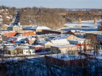 Paris, Ontario slumbers on a peaceful winter's morning as Canadian National train no. 384 rolls over the Grand River trestle, completing the picturesque scene.