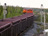 A meet on the QNS&L at Dolliver, Labrador mile 165.2 with loaded southbound AC4400CW 421 & 424, and empty northbound AC4400CW 415, & SD70ACe 503. December 06, 2010.