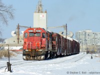 Even locals can yield surprises.. witness L559 seen with a strange leader for a local 'round these parts, GTW 4906. With the large Owens-Illinois plant in the background, and the familiar Brampton Apartment buildings I stared at from my Grandmas house for 32 years until she moved closer to Downtown, this is the Brampton (Bramalea!) I grew up to know.<br><br>L559 is seen here on the Glass Lead" with boxcars for Zochem. Normally you'd stick around with something like this, but I had <a href=http://www.railpictures.ca/?attachment_id=20690 target=_blank>Other plans on the Orangeville-Brampton Railway</a>