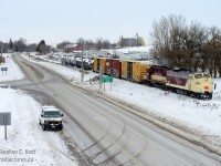 When they look this good - you can't go wrong with the Ontario Southland Railway. OSR's St. Thomas job is about to duck under the 401 at Putnam, Ontario with cars for Messenger Freight Systems and propane cars for interchange with CN in St. Thomas. 182 is letting out just a little bit of trademark ALCO smoke - but she's  burning clean and almost clear by comparison to a typical MLW.