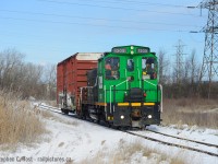The elusive Resolute Forest Products switcher, ex CN 1305 (last reported as DESX 1305) makes its infrequent, two mile run to a yard at the end of the CN Thorold spur. I had known about this operation for a while, and had made four attempts over the last 3 years to 'catch' it - just by chance - they run on an infrequent and seemingly random schedule - and this time I got lucky. What the line lacks in scenery is made up for in, well, variety - not many Green switchers out there in this Country. With only a single car - I kind of wonder how much longer this operation will last. The nearby Georgia-Pacific plant was idled in 2014 and the also nearby Hayes-Dana frame plant has been idle since 2008. This spur was once very very busy - and not to mention the Pulpwood trains that were unloaded here - long gone - see an Arnold Mooney photo in suggested photos below.


