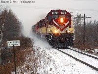 <u><b>Title: Jingle (Brass) Bells:</u></b><br><b><i>Dashing through the snow, 1800 Horspower sleigh, O'er rails covered in snow, laughing all the way!<br>Lights on handrails glow, making spirits bright, O what fun to laugh and sing a Railway song tonight! (Refrain) Jingle Bells..</i></b><br><Br></b> On New Years Eve 2005, courtesy of the Ontario Southland Railway a special surprise occurred for fans in the area. Upon arrival at Woodstock, the London Pickup was tasked with lifting two OSR locomotives for Guelph Junction. Well, Mr. President of the Ontario Southland Railway was the hogger on this days pickup.... and to commemorate the holidays the MLW's were put on the head end :) With Christmas lights on the nose of RS-18 182 it could very well be the OSR Christmas Train - to the photographers trackside, and there were many, it was. Thanks Jeff and the OSR Crew for the memories! I hope some of you young kids who were too young to see this in person can enjoy these. I was fortunate to shoot this at Ayr, Galt and Puslinch so more to come in the future.<br><br>And from my family to everyone on this site - wishing you a Merry Christmas and looking forward to a prosperous, lucky, and sun filled new year. May your 2017 be filled with joy and happiness!
