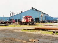 This scene is no more. Four hundred thousand square feet of structure has been leveled, and this facility is now what so many other Welland industries have become. A wasteland. The photo shows an unnumbered Stelco unit, a 45 tonner, I believe, interesting as it is equipped with side rods. At the time of this photo, the operation here was known as Stelpipe. There was a long history; before Stelpipe, which was created under a merger of Page-Hershey and Welland Tube in 1985, the two businesses operated by Stelco. In 2005 Stelpipe had gone under, a long strike helping, and Lakeside Steel Corp took over. In 2012 new buyers changed the plant to Energex Tube. In 2014 this operation in turn went under, and the whole property was razed. So now it is rubble.
Near the end of the Stelpipe operation the switcher was taken out via flatcar and the track lead pulled up in 2003. In 2009, Trillium relaid track into the plant in order they switch it. Rail history is complicated around Welland; the lead actually connected to former Conrail/CP track and used by Trillium. Barely a block to the north of this steel plant was the old Welland CASO station. I was only able to get a photo of the remains, mostly a tall brick smokestack, when happening upon the area in 1974. It is so sad to see so many years of decline in Welland.