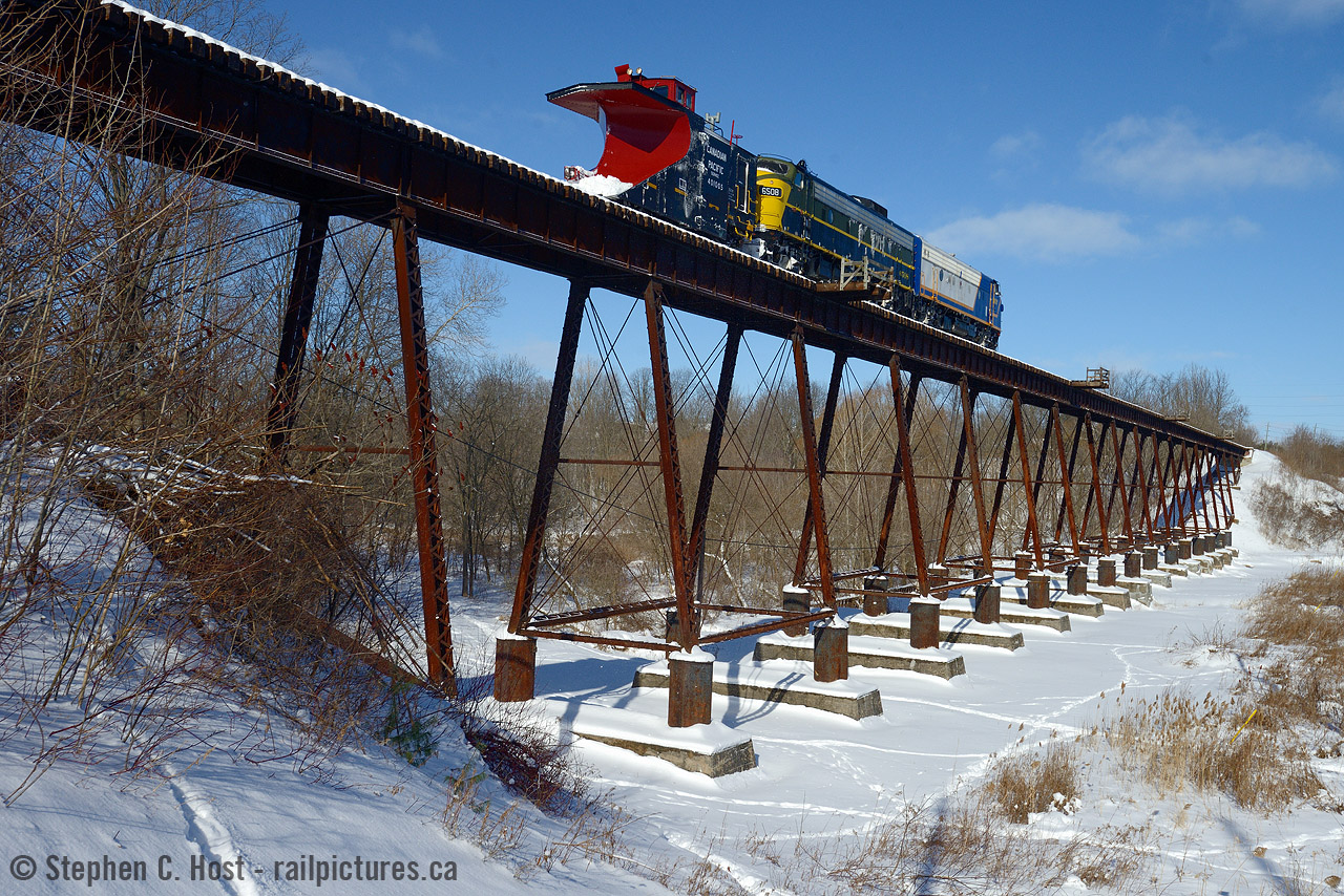 The railways in Tillsonburg seems to be defined by the bridges that cross the Big Otter Creek and the namesake valley. The St. Thomas and Eastern quit operating in 2013 mostly on account of the three large bridges in the area. But it's 2016, CN has decided to fix the Cayuga sub bridges, and it would seem that OSR is imminently to stop operating over their bridge in Tillsonburg in favour of going the other way around via St. Thomas. While this is good news as OSR re-activates a rail line from St. Thomas to Tillsonburg (and to Courtland) the CPR bridge in Tillsonburg will soon cease to have trains - for now. I wouldn't say it's done for good, chances are OSR will fix it up in due time, but probably not for a while. Anything is possible, get your photos while you still can.
History indicates this structure was built around 1897 when the CPR built a 'loop line' to reach the CASO. For a year or two prior, the Tillsonburg, Lake Erie and Pacific railway used 3 miles of the GTR plus their station to access Tillsonburg. Corrections always appreciated and welcome. Merry Christmas everyone!