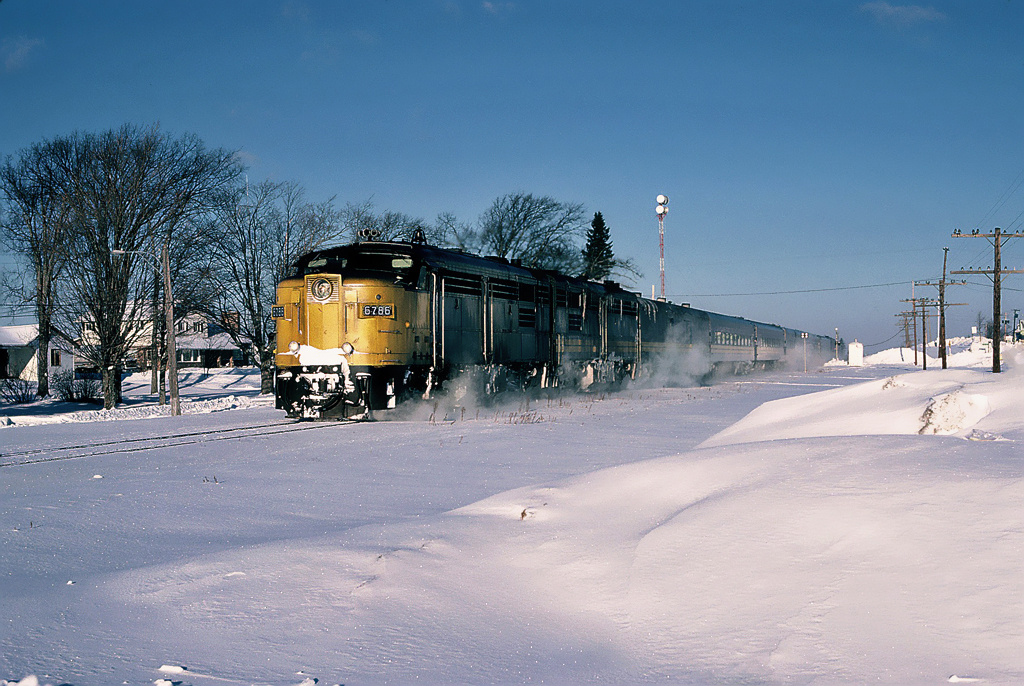 Eastbound VIA Rail train 14 The Ocean with MLW FPA-4 6786 and FPB-4 6864 in Eastern New Brunswick. January 07, 1985.