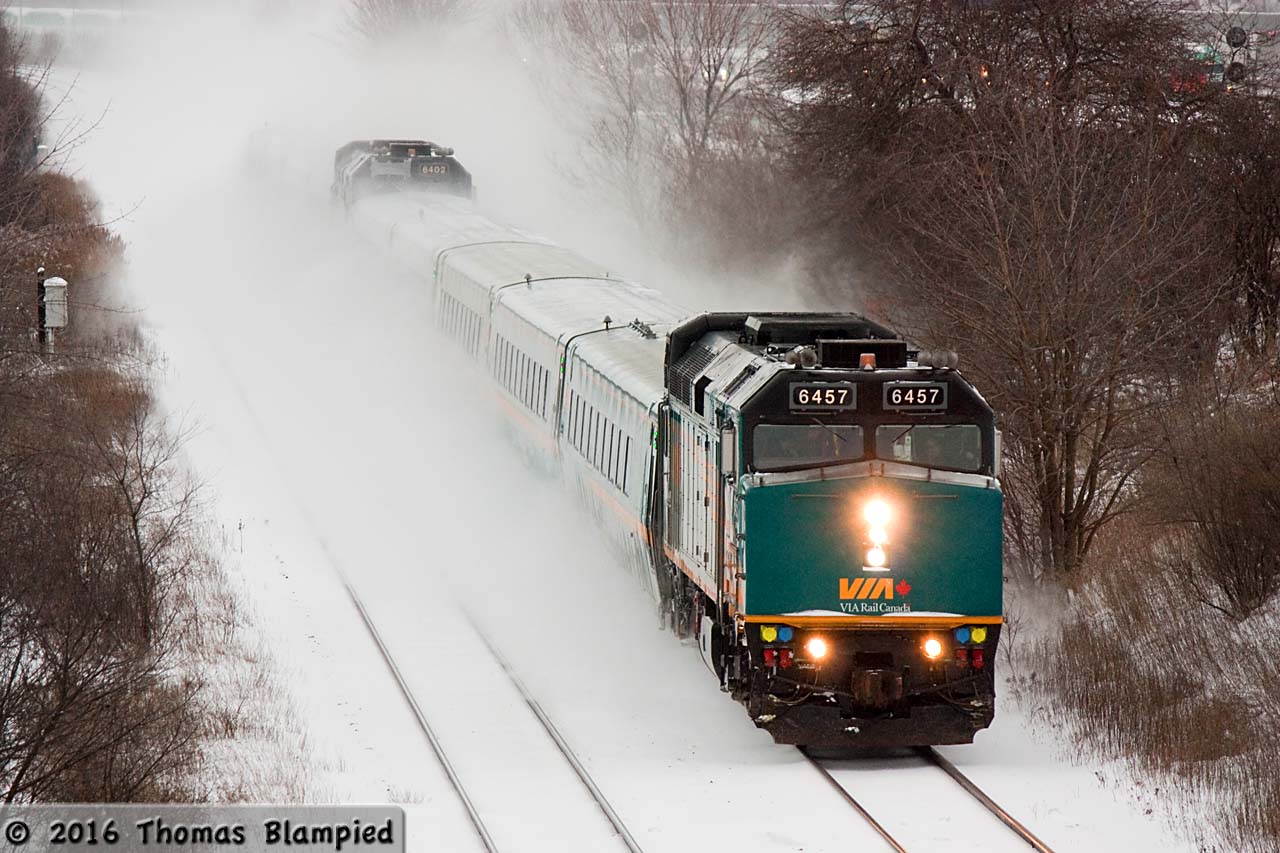 Why bother driving through the snow? The second of VIA's morning J-trains is right on time as it prepares for a stop at Oshawa. The second half of the consist is being led by VIA 6402, which has the engineer's side numberboard patched over with copious amounts of the "handyman's secret weapon": duct tape.