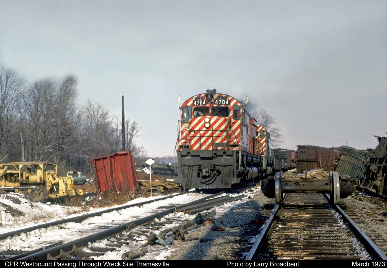 CPR 4704 cautiously proceeds through Wreck site Thamesville Ontario. March 1973