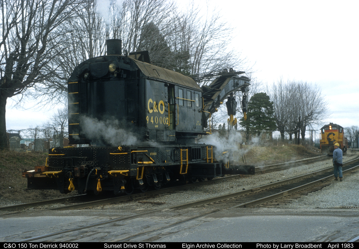 C&O 150 Ton Crane 940002 heads back to Shop on Wilson Ave St Thomas under its own Steam Power after rerailing Locomotive at East end of Kettle Creek Bridge. April 1983